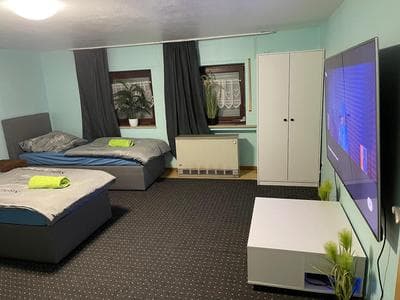 Chambre avec 3 lits