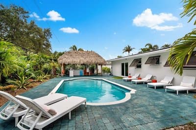 Eccentric Home With Pool Tiki hut Outdoor Kitchen