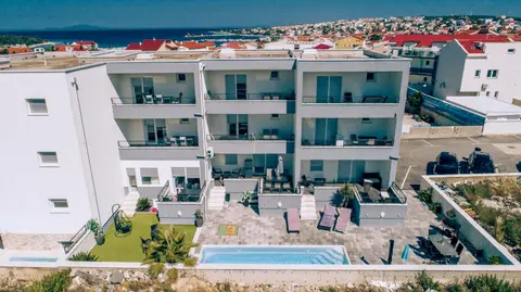 Apartments AM'AN with pool, Novalja