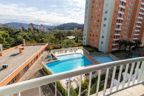 Apto a 10 min da Vila Germânica, dois quartos, salas de estar e jantar, cozinha completa, sacada com churrasqueira, Wi-Fi, Piscina, academia, mercadinho 24