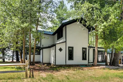 Torch Lake Getaway w/ Private Beach + Boat Dock!