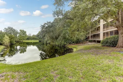 Secluded Condo with Peaceful Wooded Views and Easy Access to the Beach by RedAwning