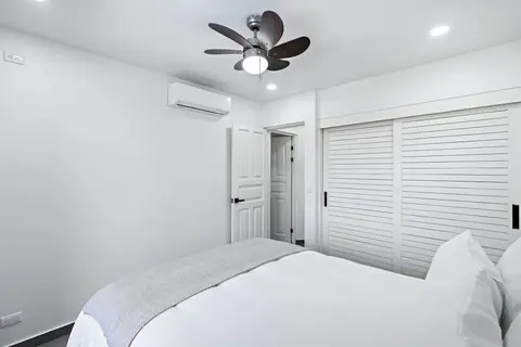 Modern Split-Level 2-Bedroom Condo with Pools, Terrace & Easy Beach Access