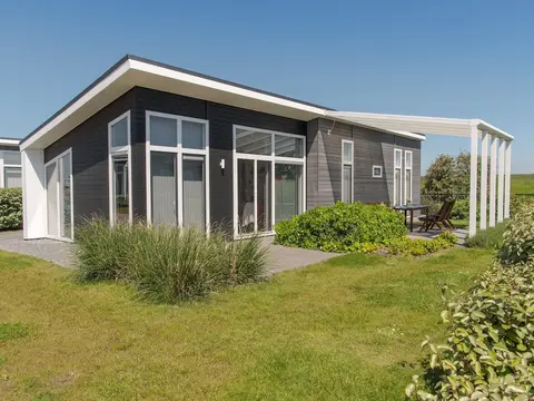 Nice Chalet with Fireplace near Oosterschelde