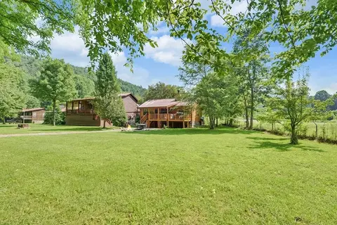 Riverfront Cabin w/ Hot Tub & Mountain Views!