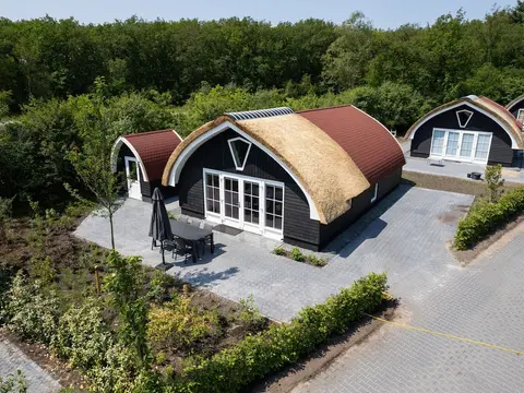 House With a Terrace on the Edge of the Forest