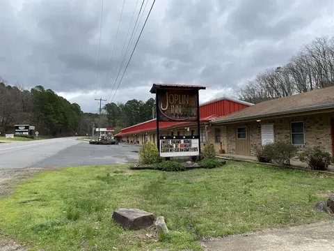 Queen Guest Room located at the Joplin Inn at the entrance to Mountain Harbor, just 2 1/2 miles from Lake Ouachita. by RedAwning