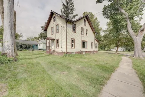 Centrally Located Albion Home With Screened Porch!