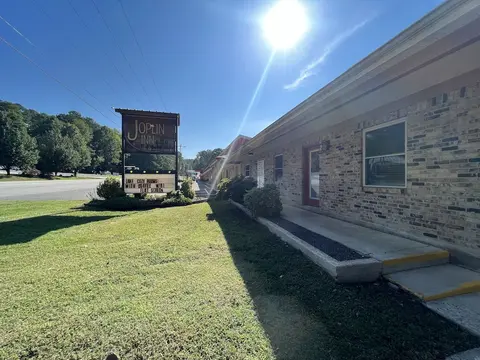 Queen Guest Room located at the Joplin Inn at the entrance to Mountain Harbor,, just 2 1/2 miles from Lake Ouachita. by RedAwning