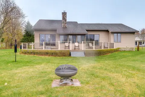 Cadillac Vacation Rental w/ Dock on Lake Mitchell!
