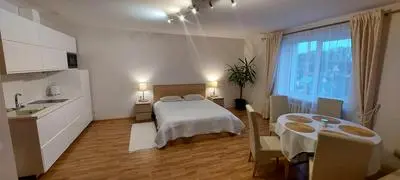 Apartamentai šalia baseino