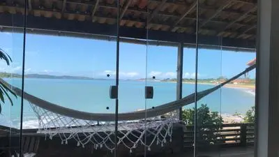 Búzios casa pé na areia em condomínio beira mar