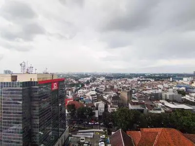 Spaicous 1BR with City View at Grand Asia Afrika Apartment By Travelio