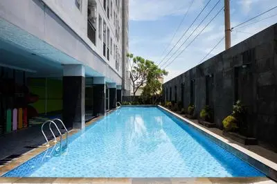 Trendy and Tidy Studio Room at Puri Mas Apartment By Travelio